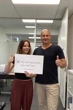 Happy patient with chiropractor